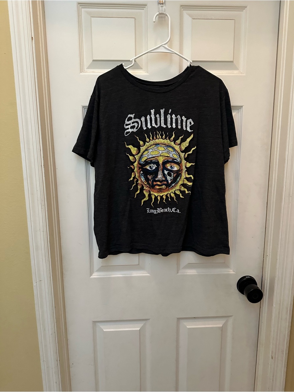 Black Graphic T‑Shirt with Sun Logo